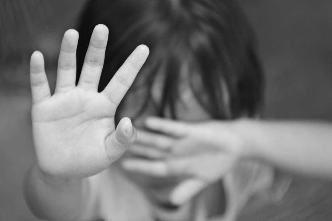 child stopping with his hand